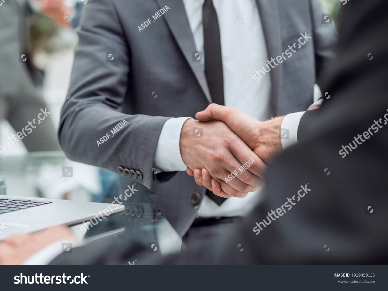 close up. handshake of business people in the office #1929459035