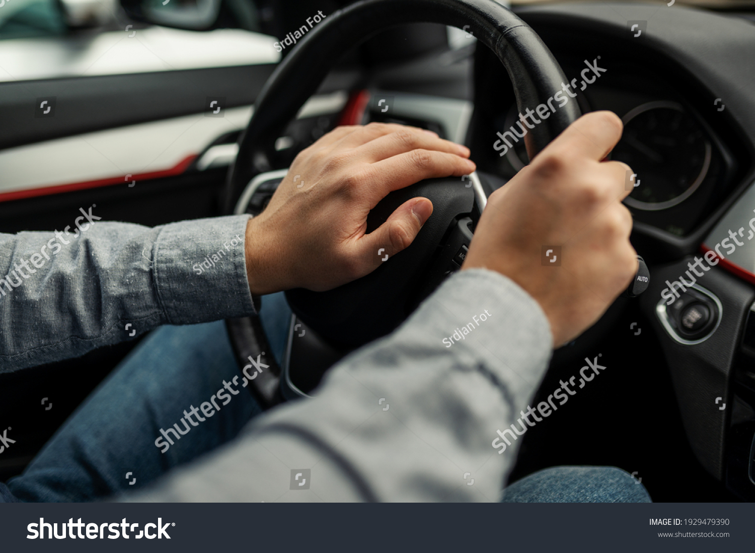 angry driver presses the horn of the car to attract the attention of the car bully and avoid road accident. Stress and aggressive driving on city streets #1929479390