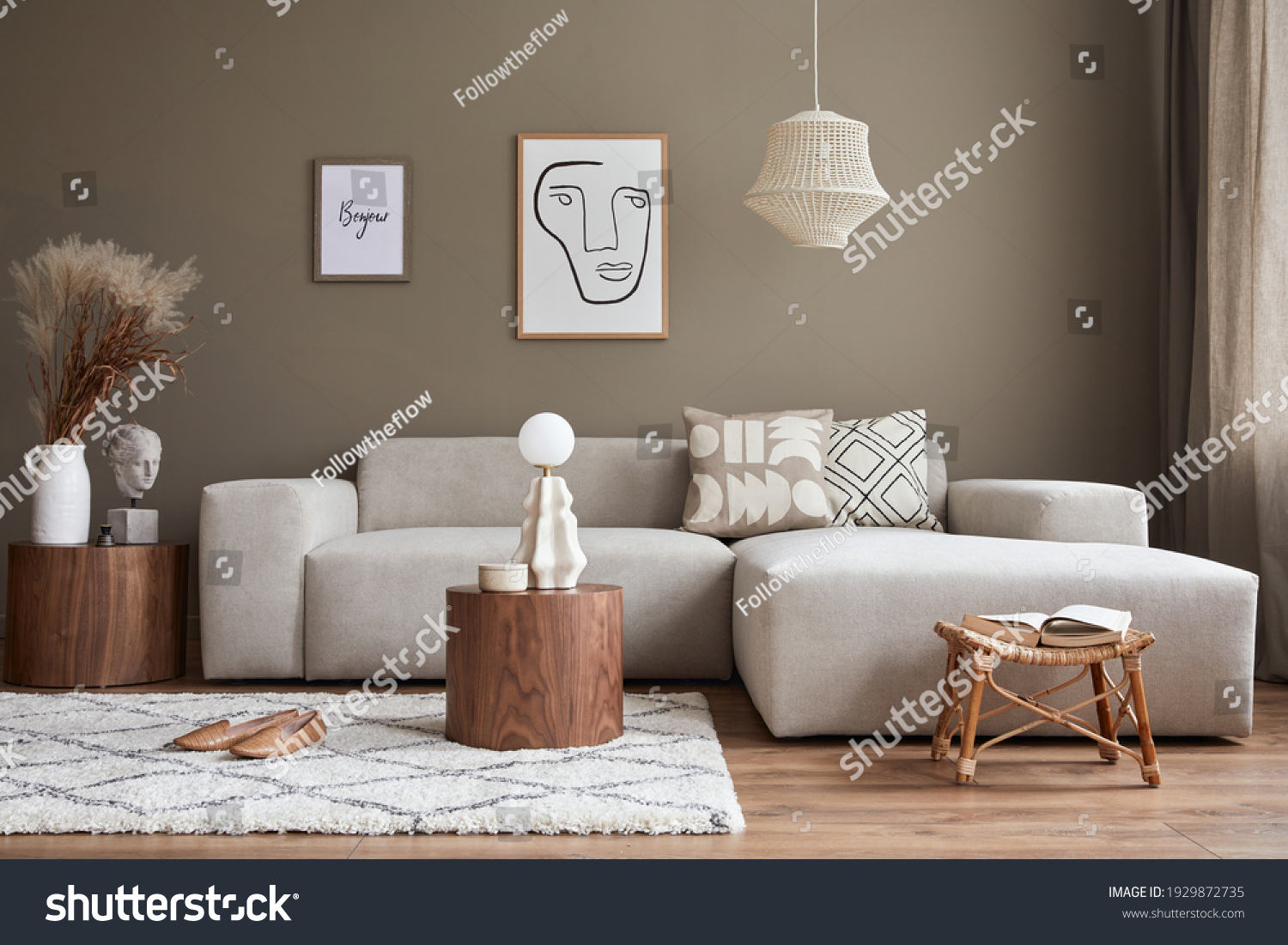 Interior design of cozy living room with stylish sofa, coffee table, dired flowers in vase, mock up poster, carpet, decoration, pillows, plaid and personal accessories in modern home decor. Template. #1929872735