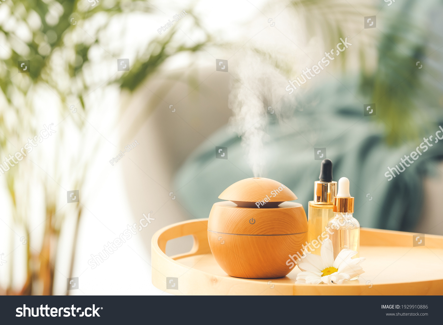 Aroma oil diffuser on table in room #1929910886