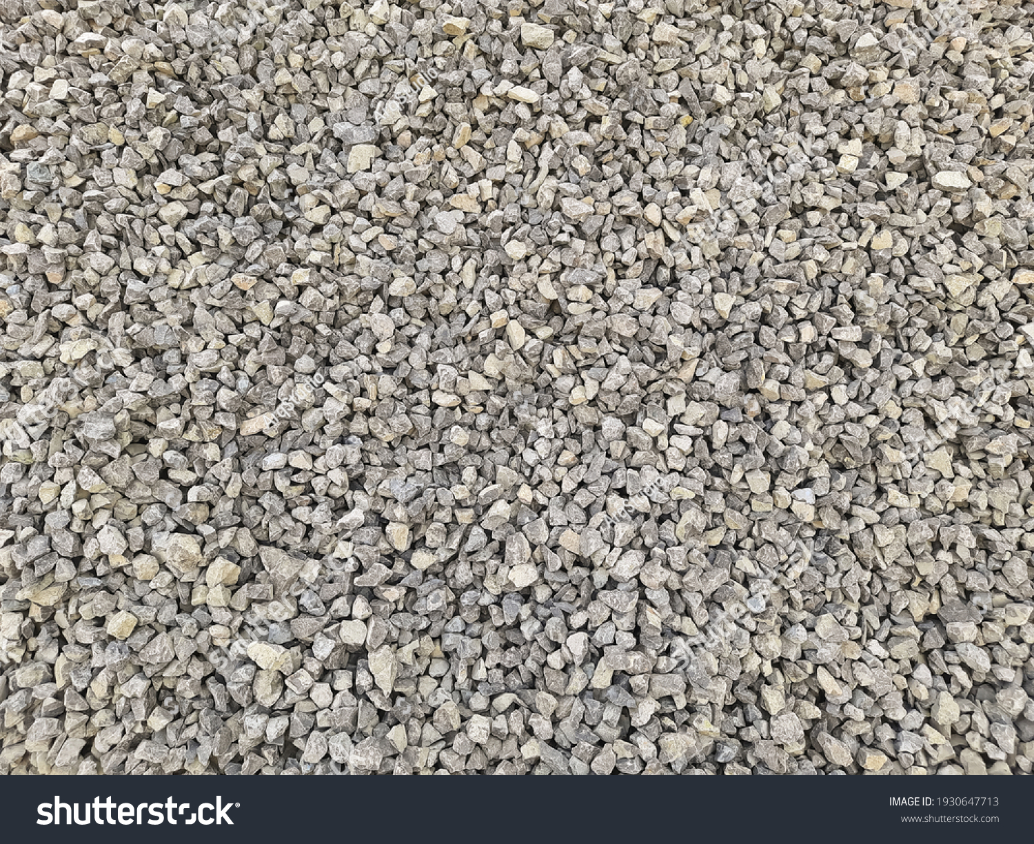 Gray small rocks ground texture. black small road stone background. gravel pebbles stone seamless texture, marble. dark background of crushed granite gravel, close up. grey clumping clay #1930647713