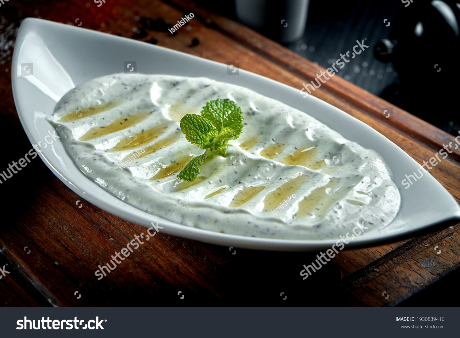 Haydari is a type of yogurt made from certain herbs and spices, combined with garlic. Turkish cuisine. Close up, selective focus #1930839416