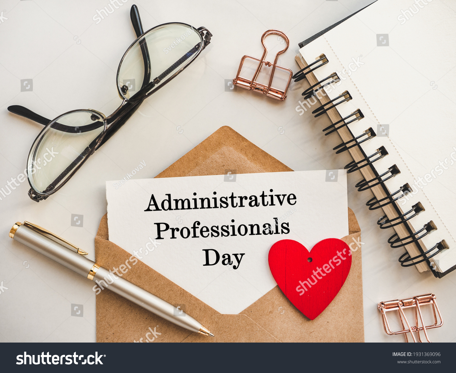 Admin Day Greeting Card. Close-up, view from above, wooden surface. Concept of preparation for a professional holiday. Congratulations for relatives, friends and colleagues #1931369096