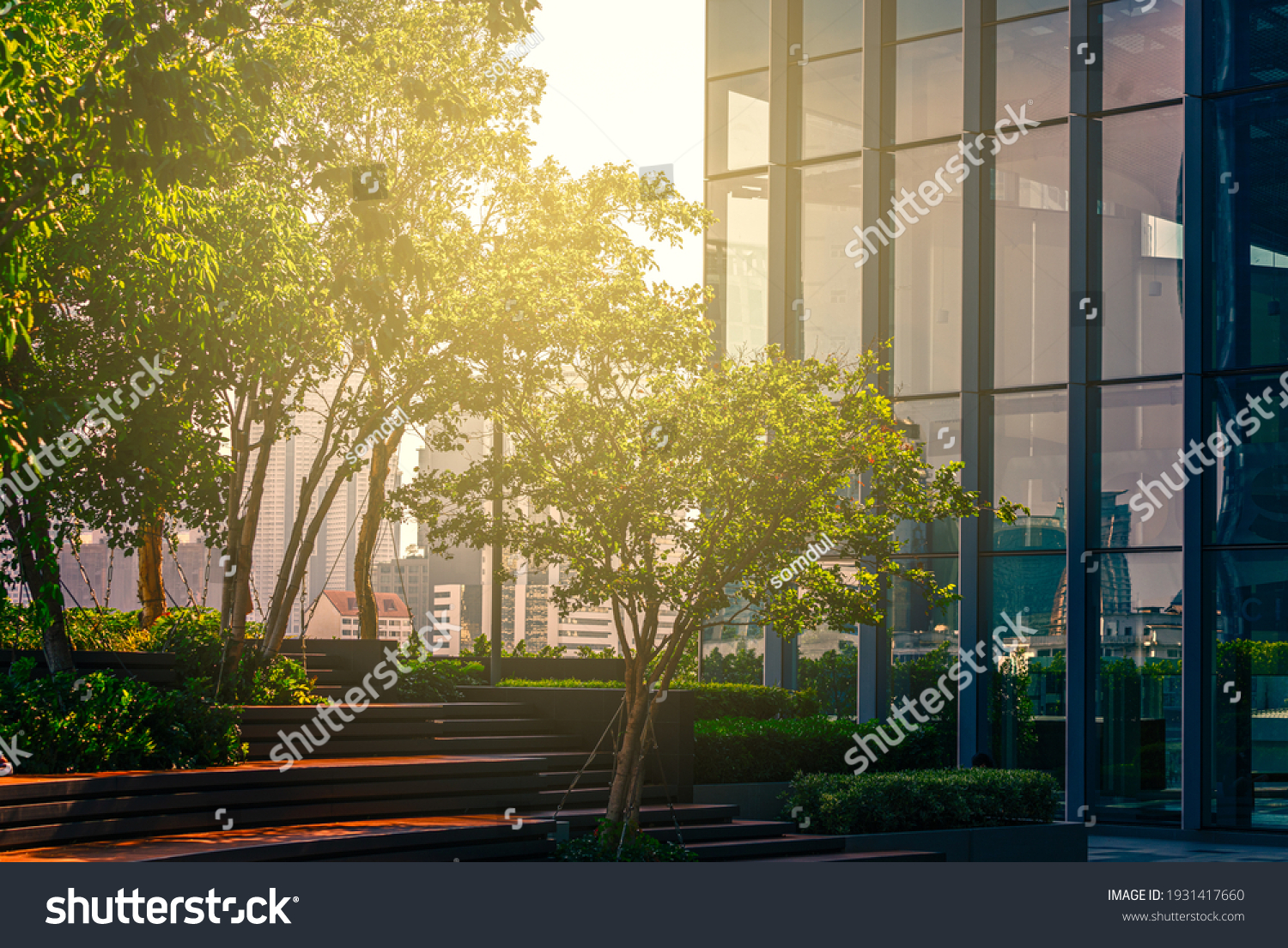 Beautiful garden on rooftop of modern glass building in Asia, concept for corporate buildings. #1931417660