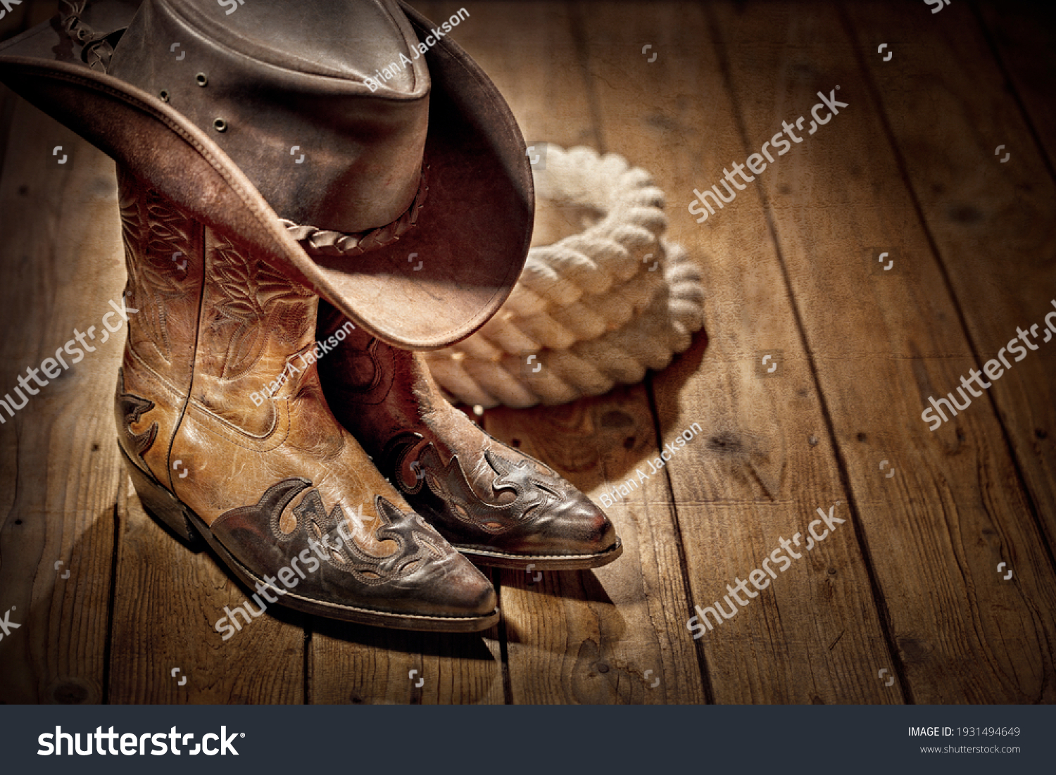 Country music festival live concert or rodeo with cowboy hat and boots background #1931494649