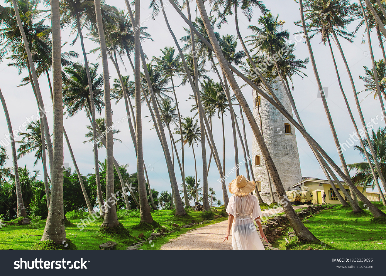 Girl in Sri Lanka on an island with a lighthouse. Selective focus. nature. #1932339695