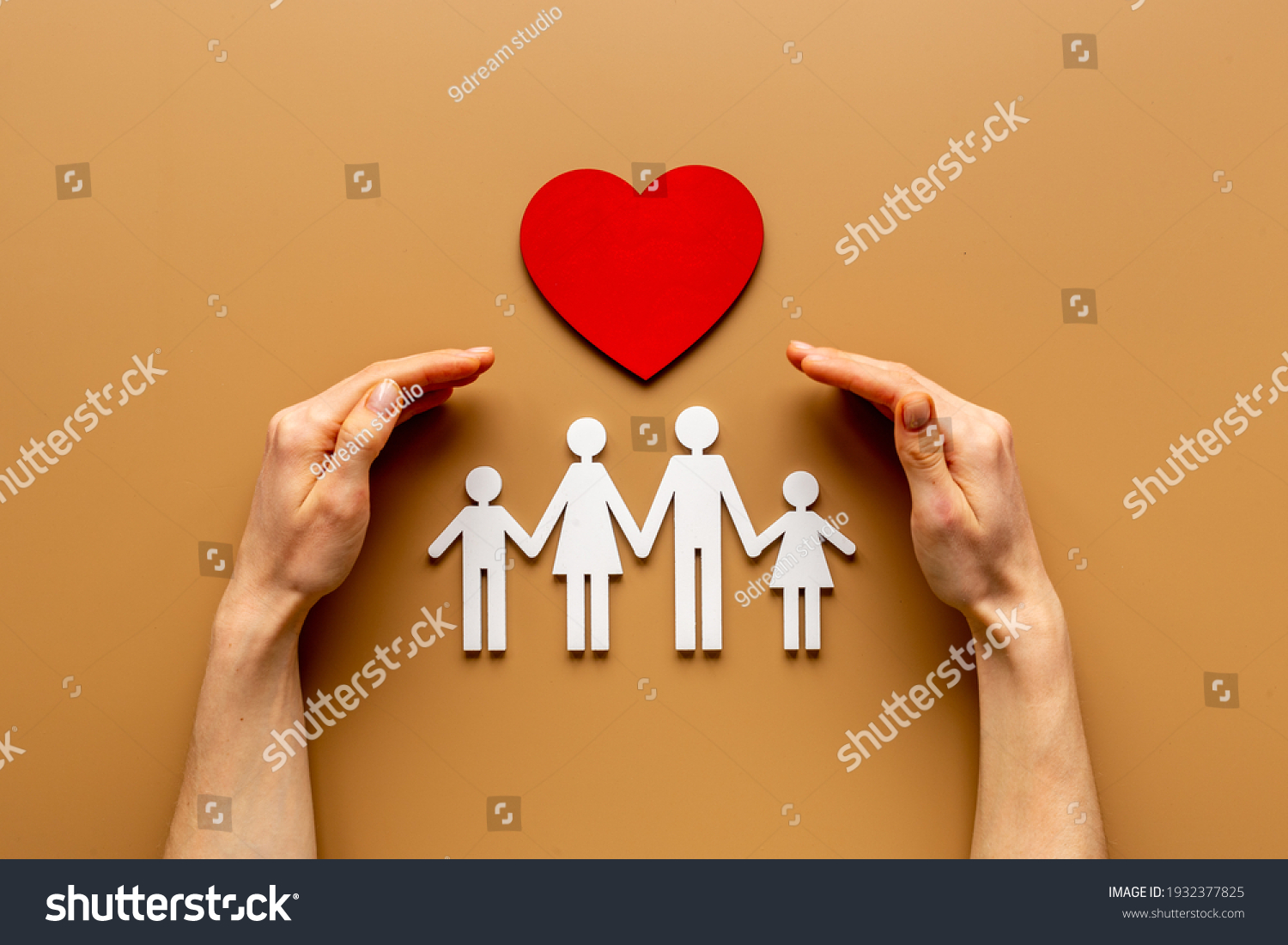 Hands holding family figure. Life and health insurance concept. #1932377825
