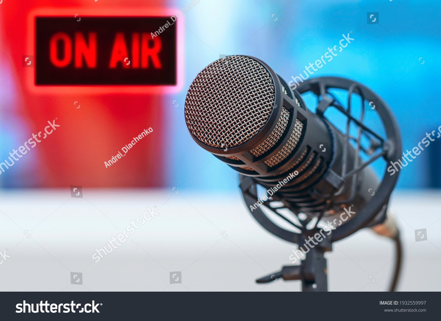Professional microphone in radio station studio and on air sign #1932559997