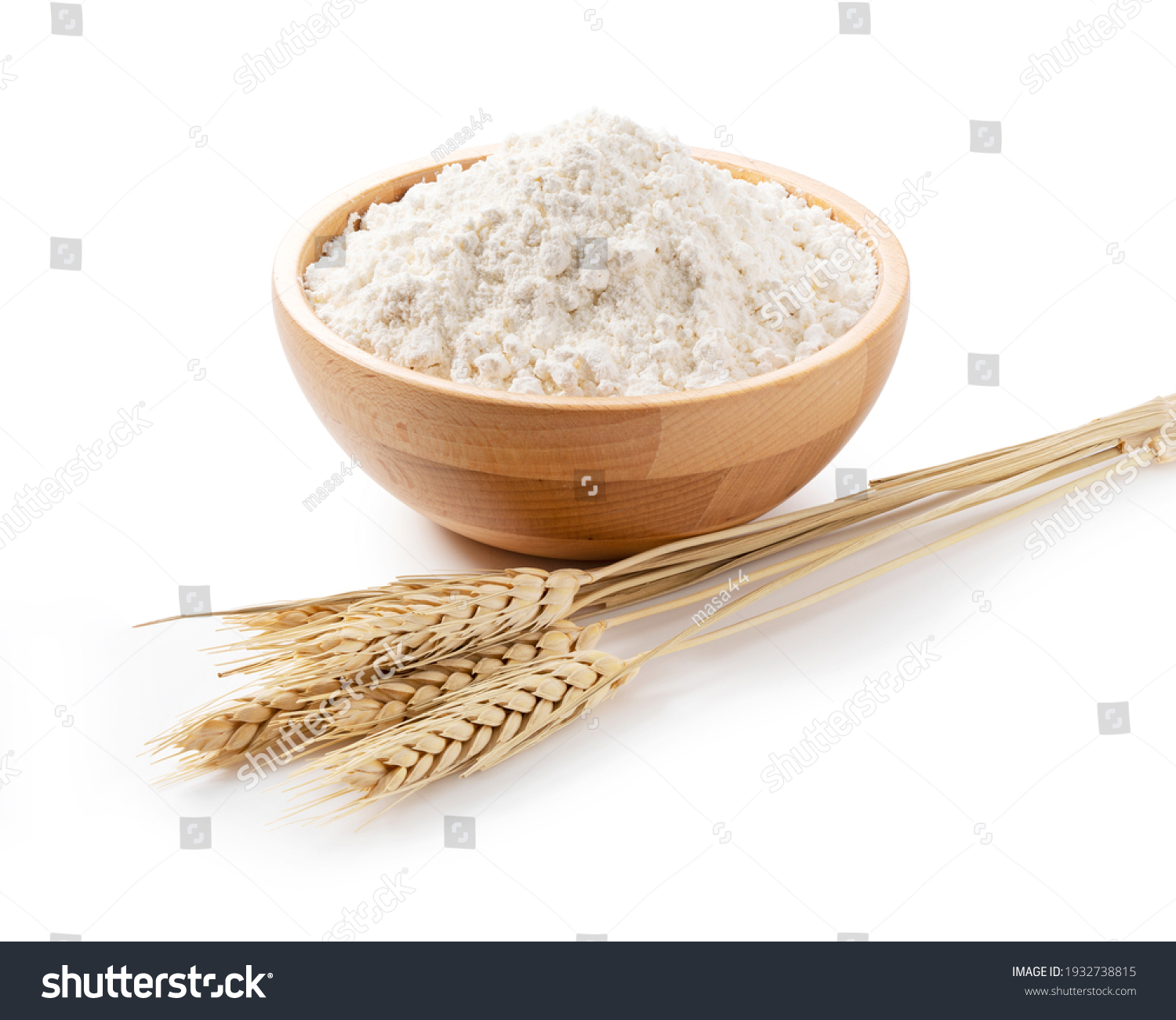 Ears of wheat and flour in a wooden bowl on a white background. Close-up, Material Photo #1932738815