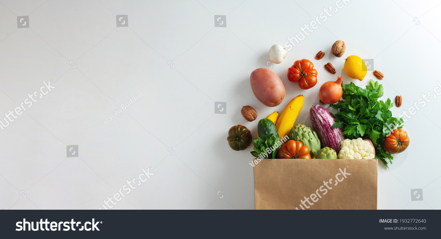 Delivery healthy food background. Healthy vegan vegetarian food in paper bag vegetables and fruits on white, copy space, banner. Shopping food supermarket and clean vegan eating concept #1932772640