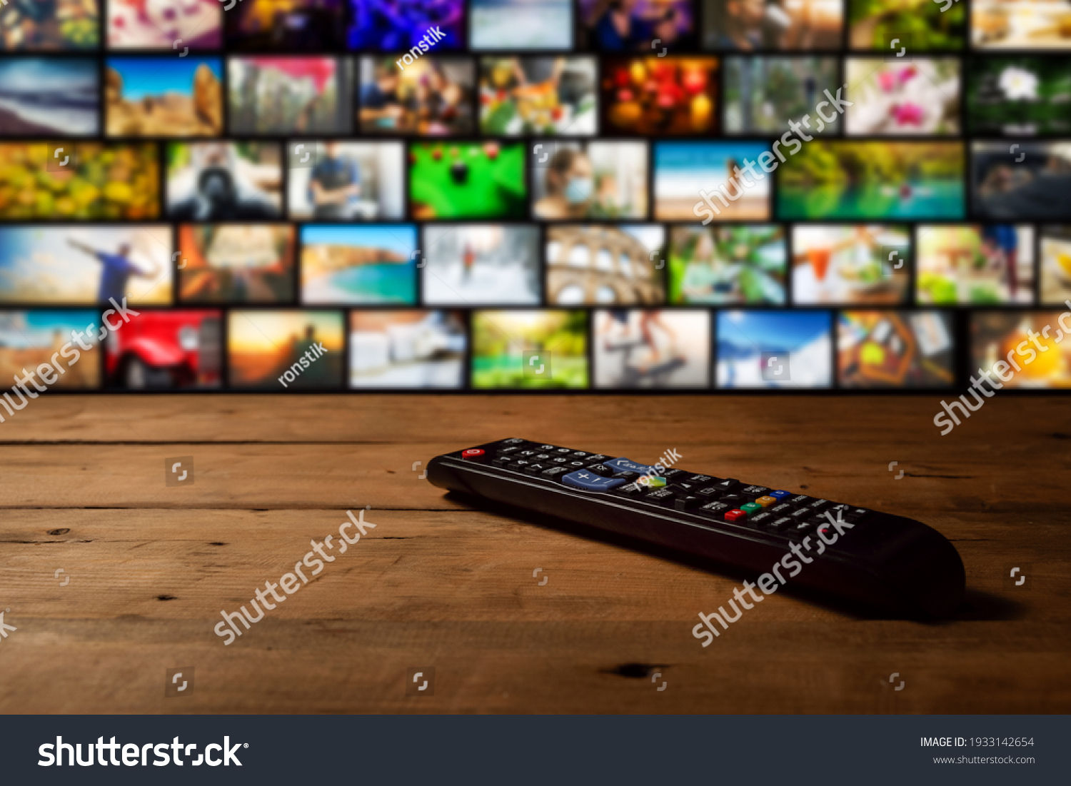 smart tv interactive television - channel collage with remote control on the table #1933142654