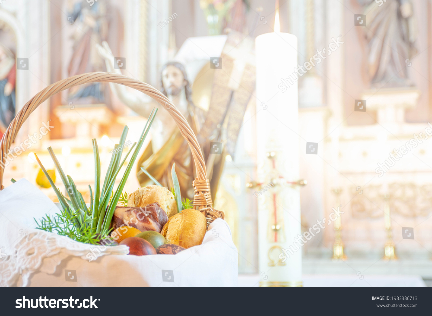 Easter food basket for blessing in church, catholic eastern european custom with eggs, spring onion, ham and bread, artistic edit #1933386713