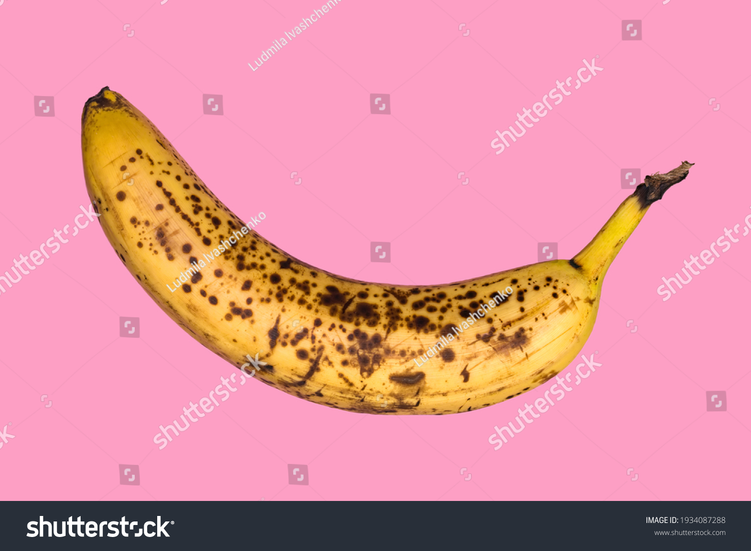 Rotten banana isolated on pink background. Expired fruit. #1934087288