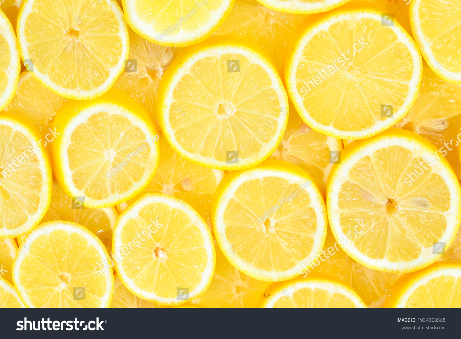 A slices of fresh juicy yellow lemons.  Texture background, pattern. #1934368568