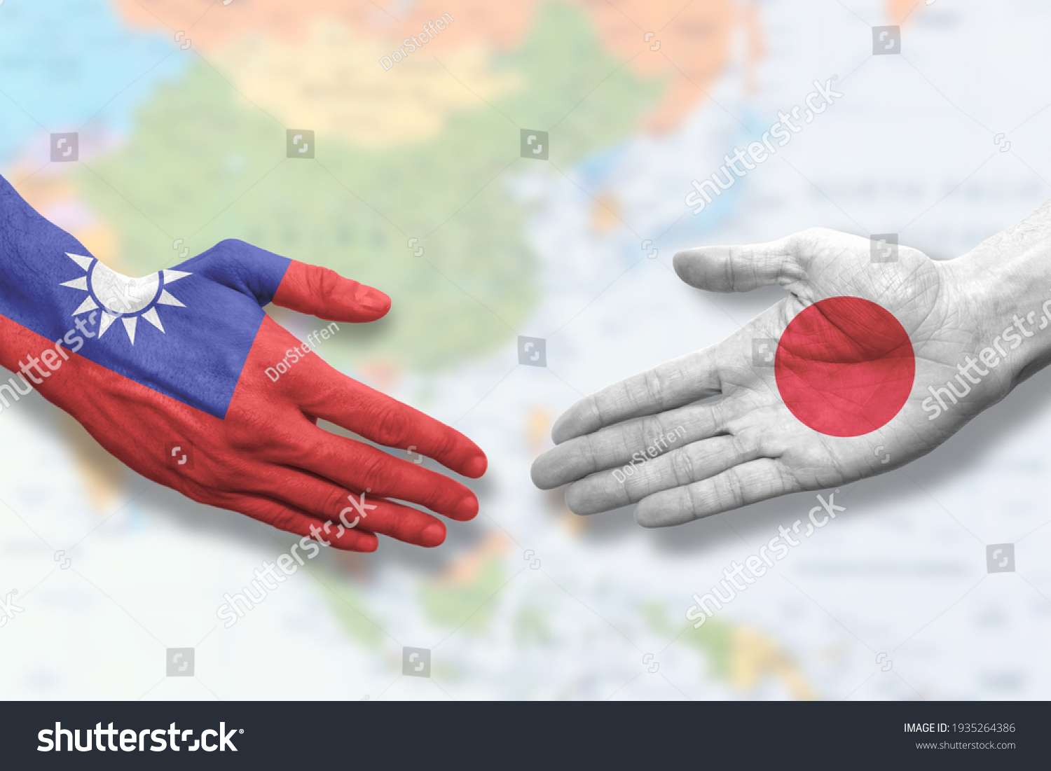 Taiwan and Japan - Flag handshake symbolizing partnership and cooperation #1935264386