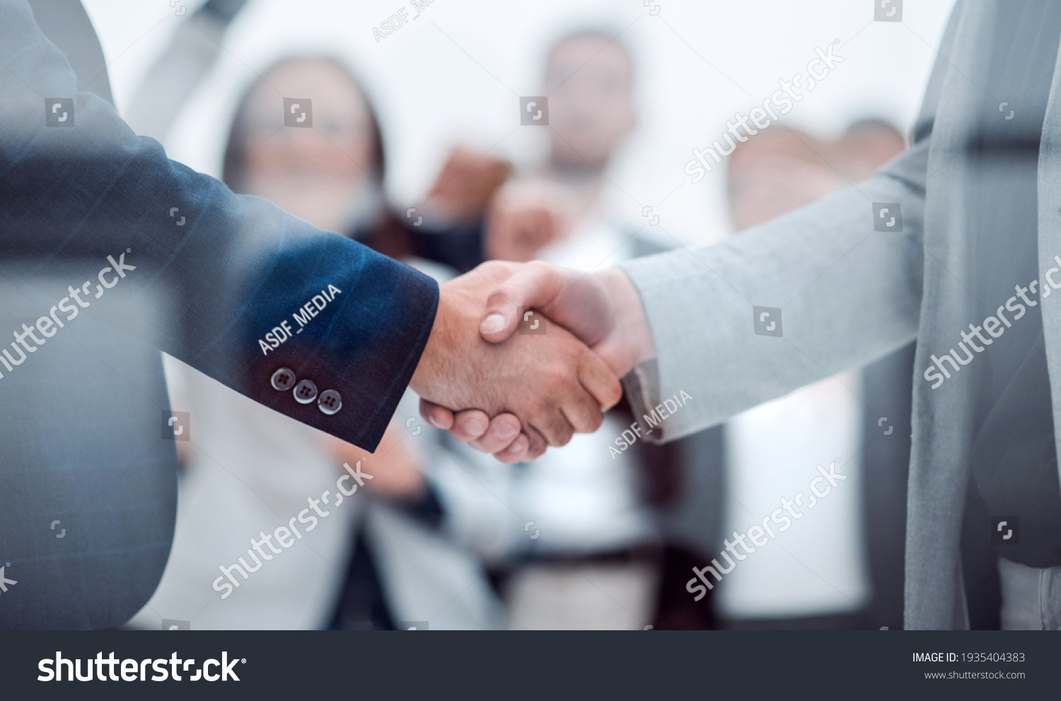 close up. confident business handshake on an office background. #1935404383