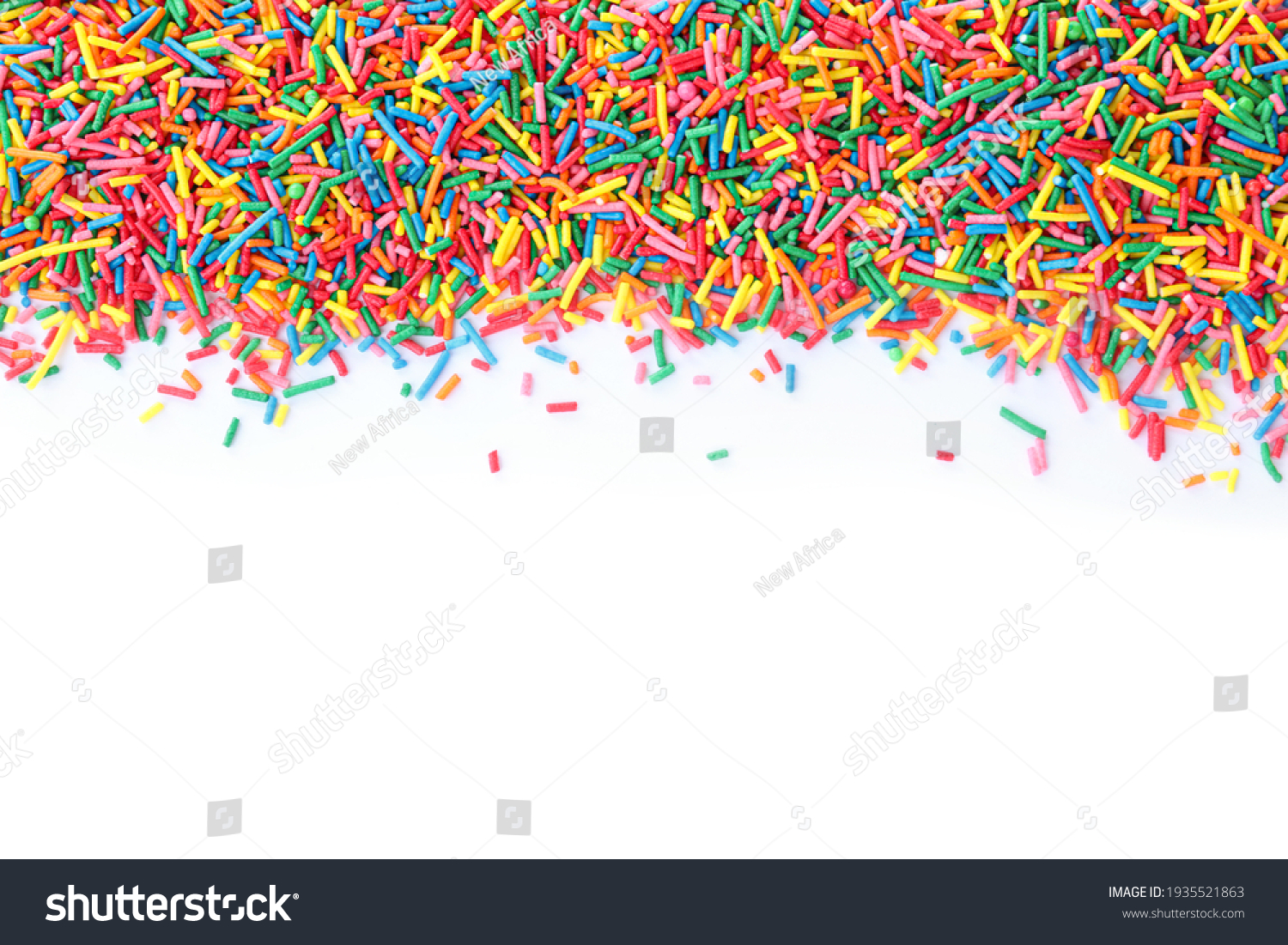 Colorful sprinkles on white background, top view. Confectionery decor #1935521863
