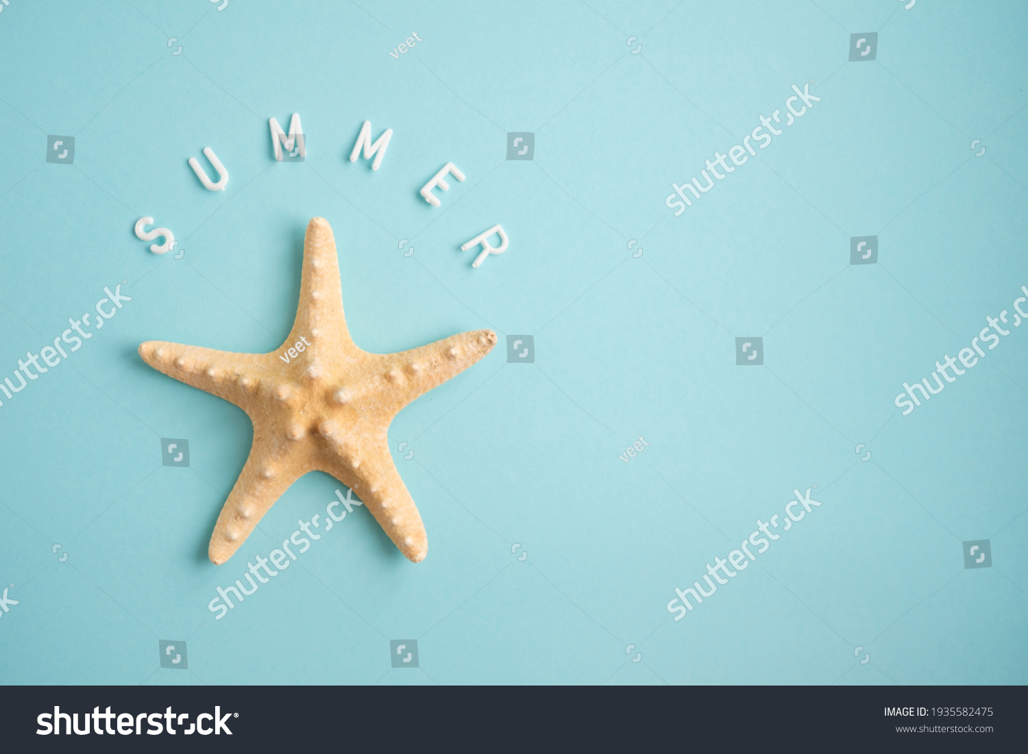 Starfish on a blue background and the word Summer. Vacation concept.  #1935582475