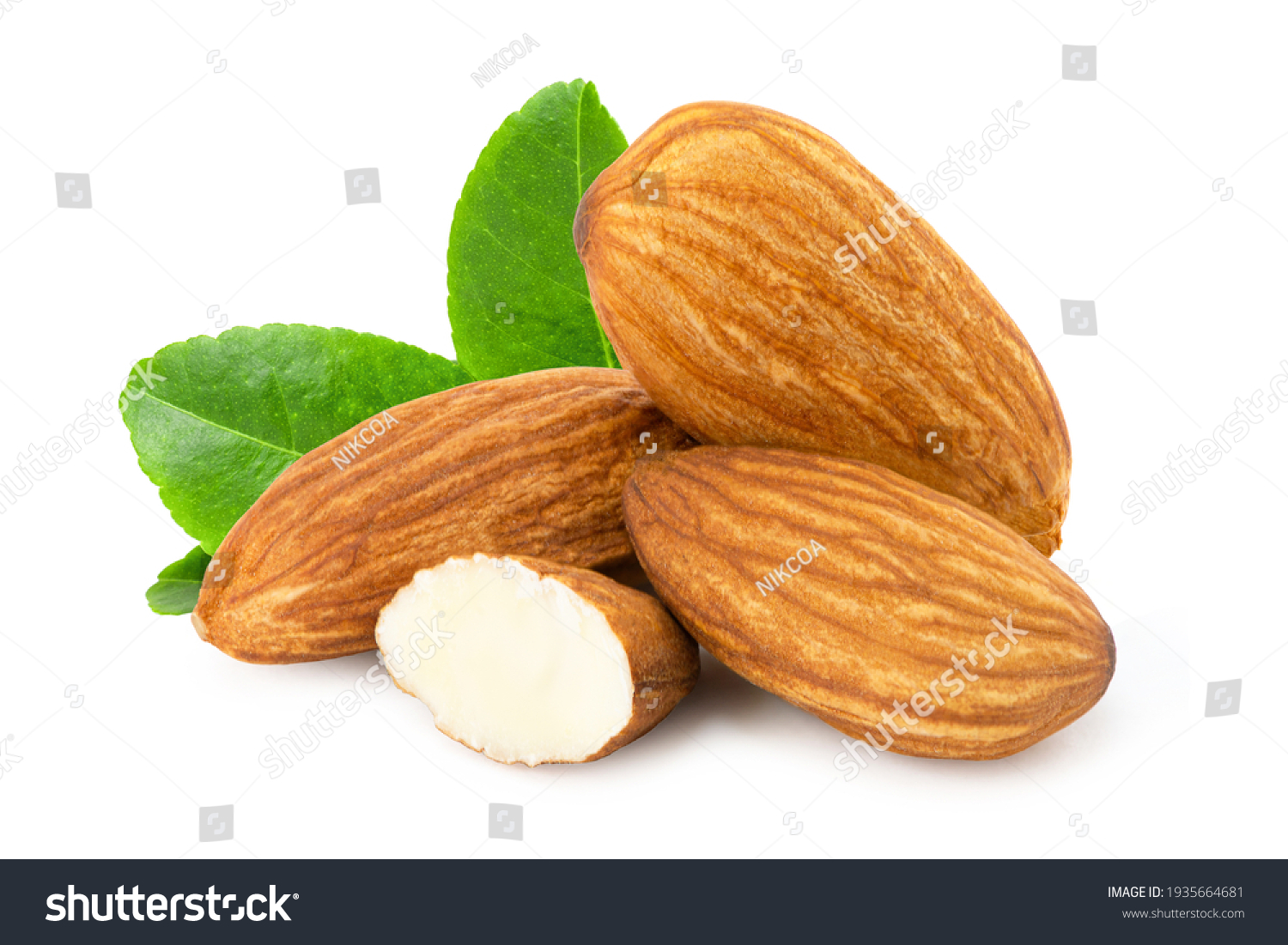 Pile of almond nuts and almond slice with green leaf isolated on white background. #1935664681
