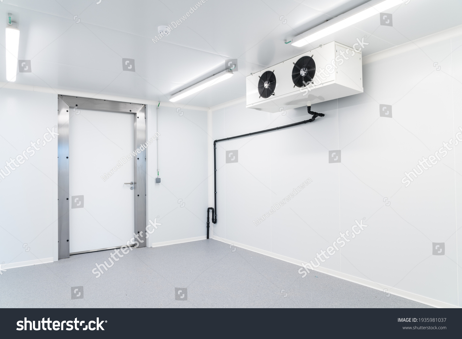 an empty industrial room refrigerator with four fans #1935981037