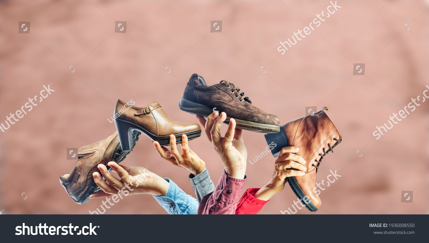 Hands holding different men and women shoes and boots. Concept of selection, purchase and repair of shoes. #1936008550