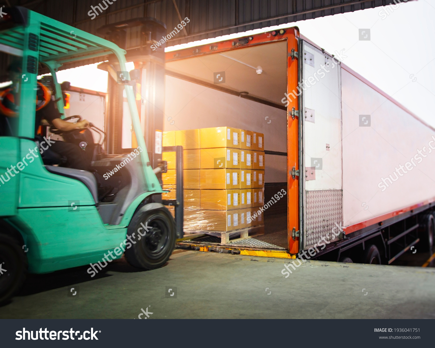 Forklift Tractor Loading Package Boxes into Cargo Container. TrailerTruck Parked Loading at Dock Warehouse. Shipment Delivery. Supply Chain. Shipping Warehouse Logistics Freight Truck Transportation. #1936041751