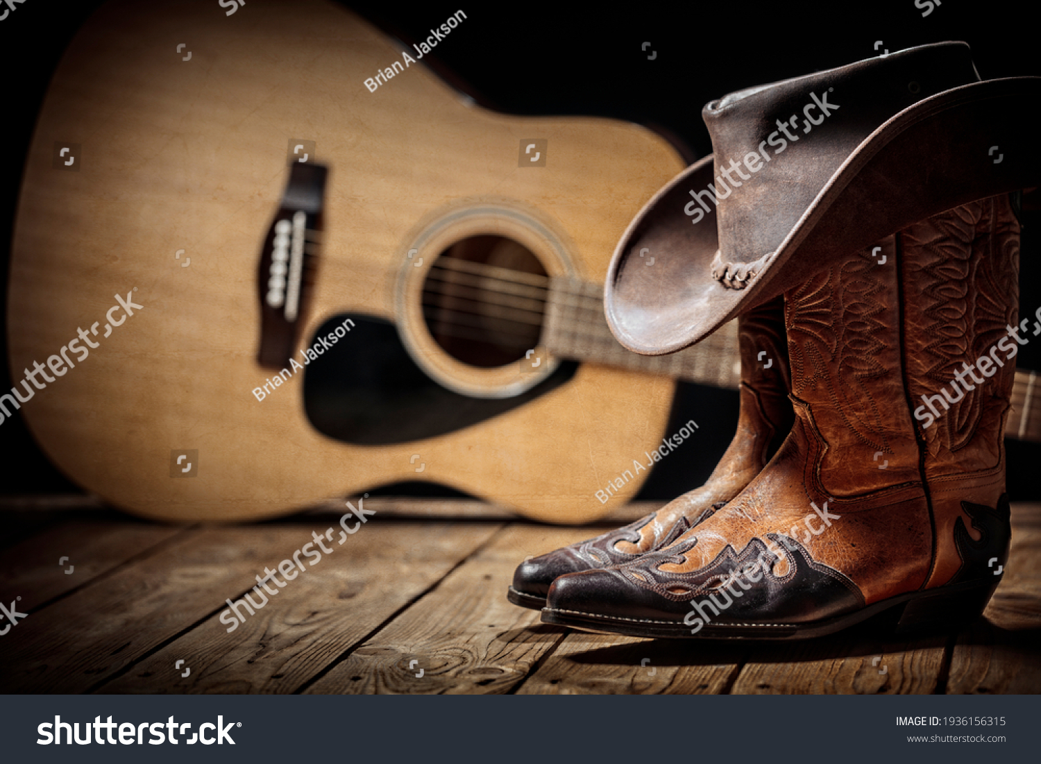 Country music festival live concert with acoustic guitar, cowboy hat and boots background #1936156315