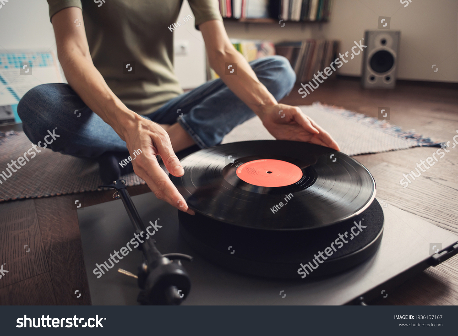 Woman listening to music, relaxing, enjoying life, having fun on home party. Turntable playing vinyl LP record. Leisure, lockdown, retro revival, hobby, lifestyle concept #1936157167