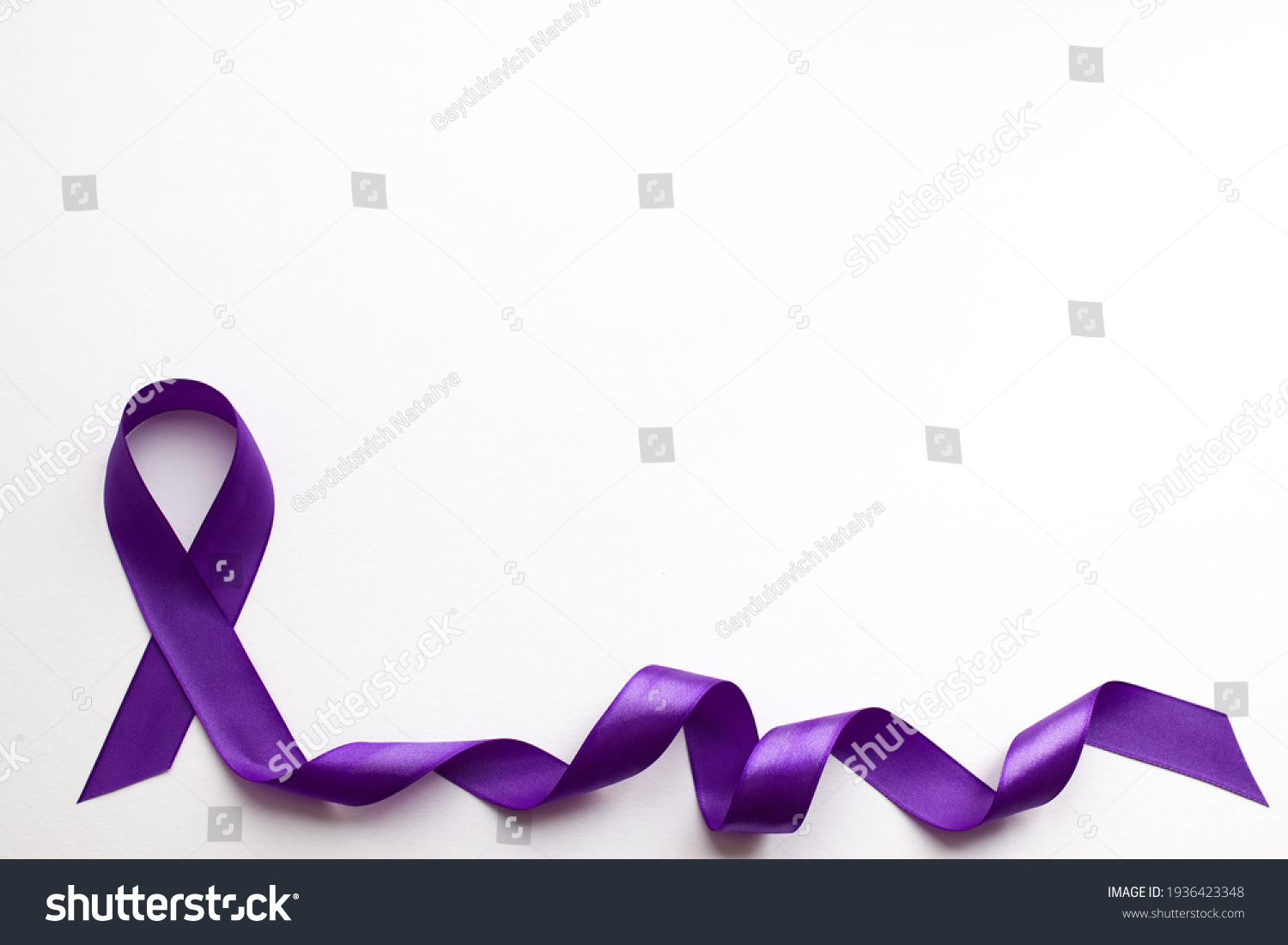 Purple ribbon on white background with place for text in honor of the day of patients with epilepsy on March 26 #1936423348
