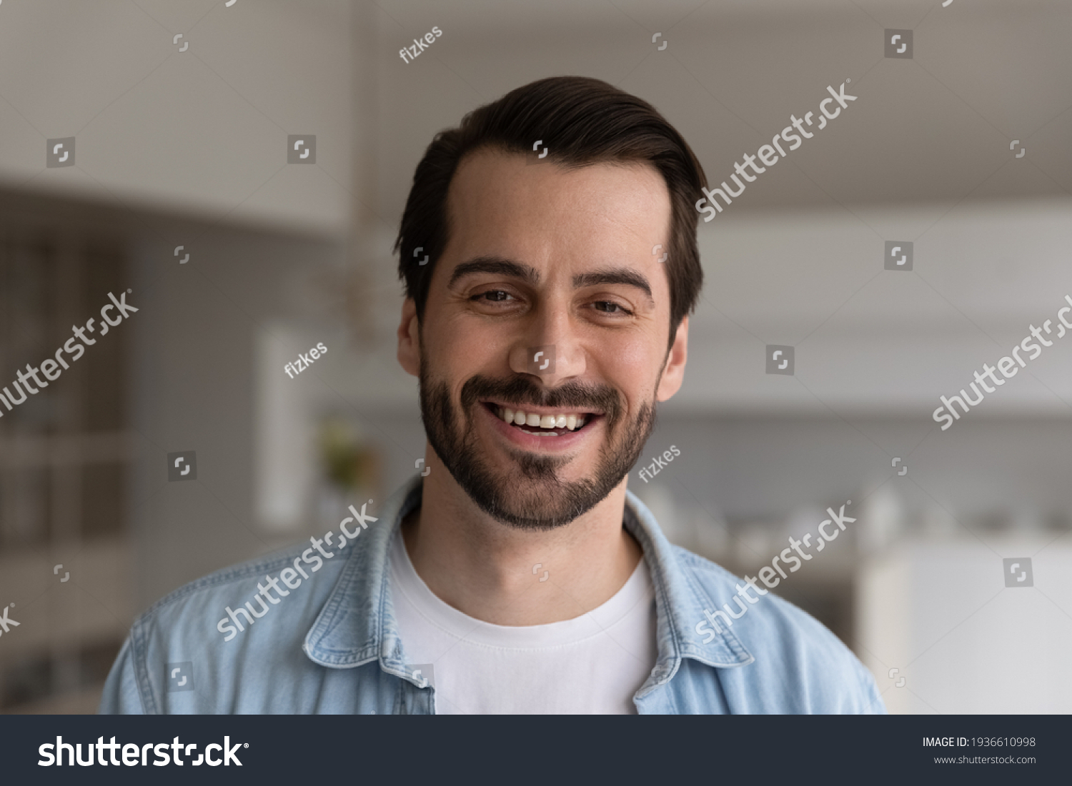 Close up headshot portrait of smiling 30s Caucasian man look at camera posing in own flat or apartment. Profile picture of happy 20s male renter or tenant in new home. Real estate, rental concept. #1936610998