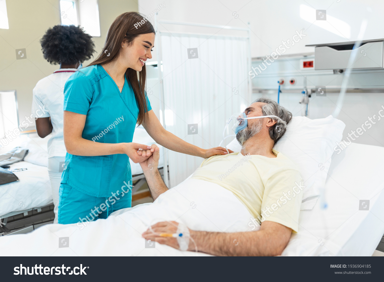 Healthcare concept of professional doctor consulting and comforting elderly patient in hospital bed or counsel diagnosis health. Medical doctor or nurse holding senior patient hands and comforting him #1936904185