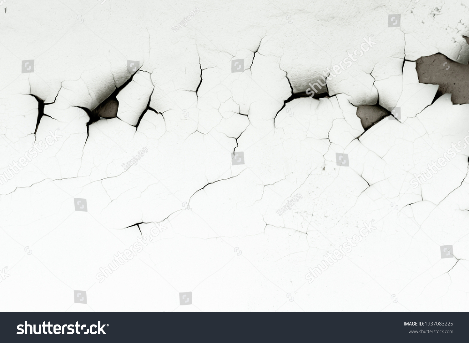 Old white paint on wall. Surface texture with cracked peeling paint. Close-up background. #1937083225