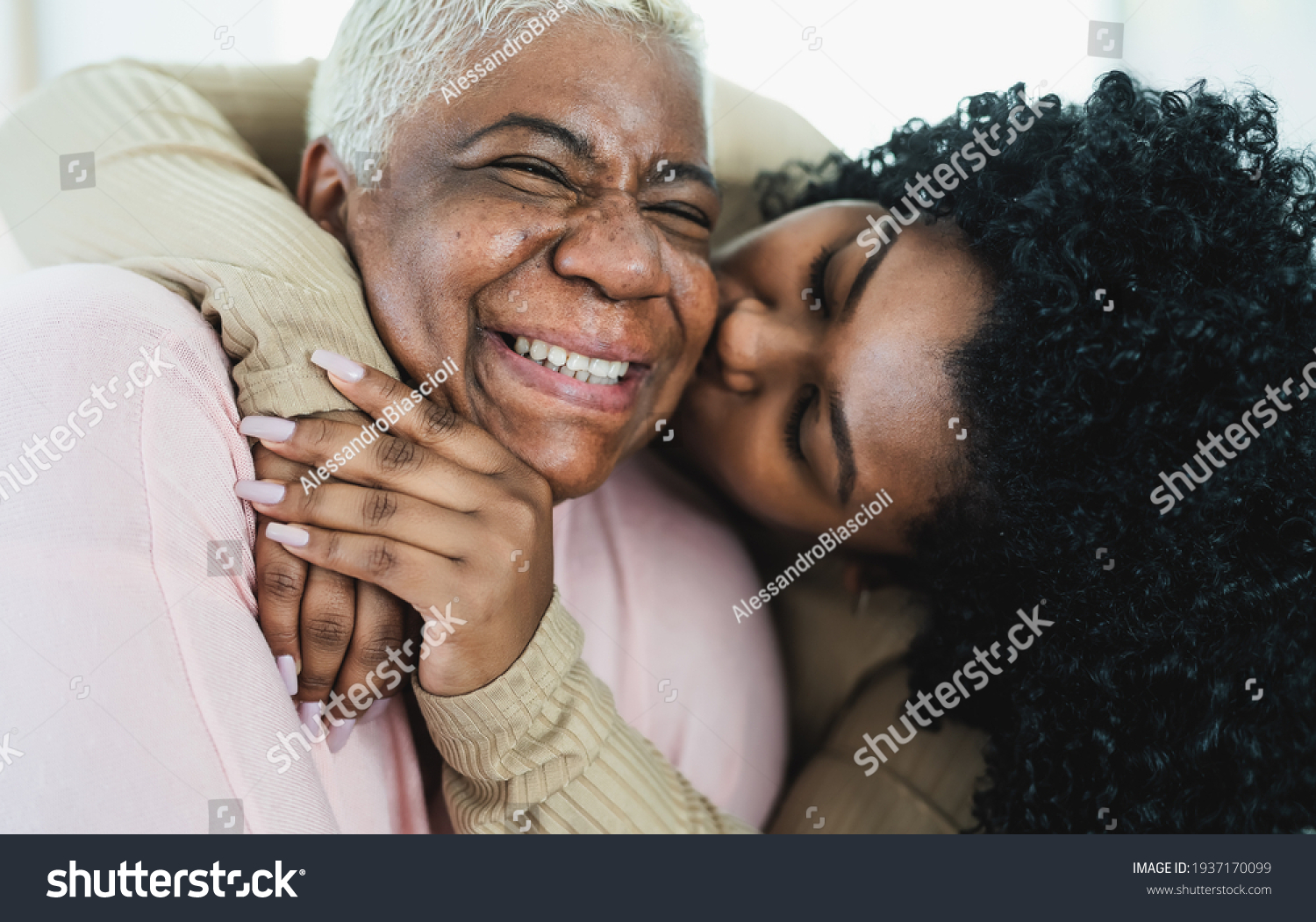 Happy Hispanic mother and daughter having tender moment together - Parents love and unity concept #1937170099