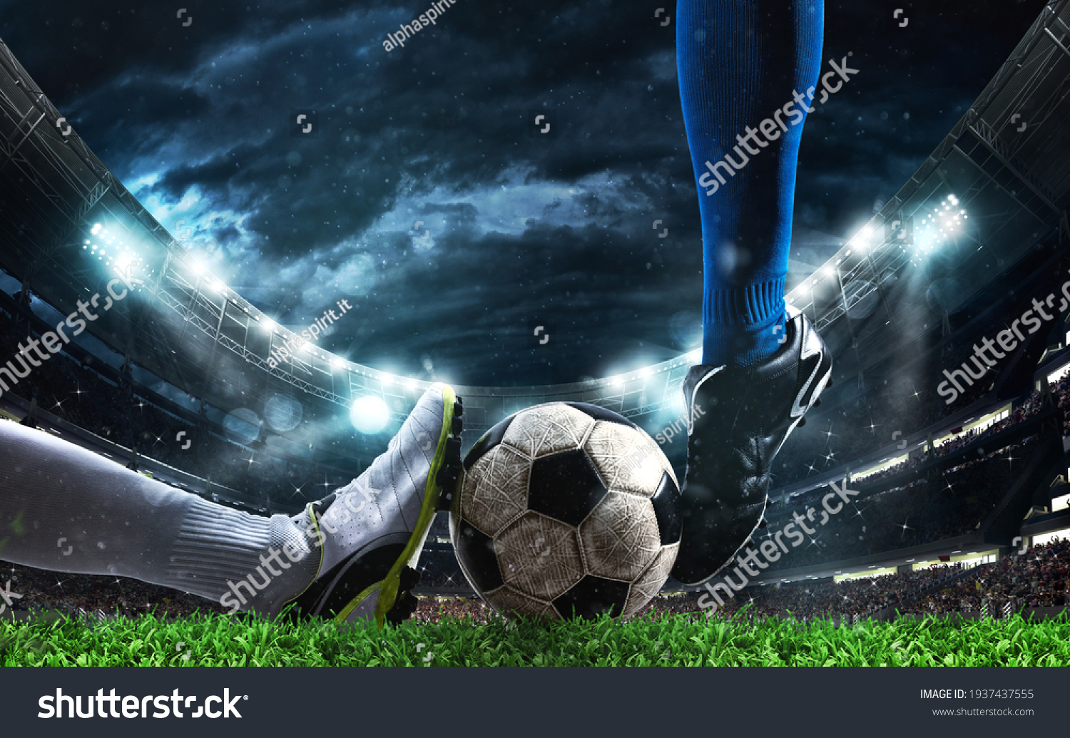Close up of a football action scene with competing soccer players at the stadium #1937437555