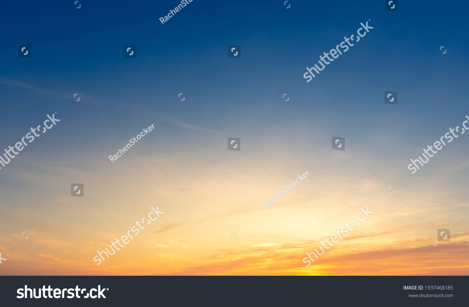 Beautiful Vivid sky painted by the sun leaving bright golden shades.Dense clouds in twilight sky in winter evening.Image of cloud sky on evening time.Evening Vivid sky with clouds. #1937468185