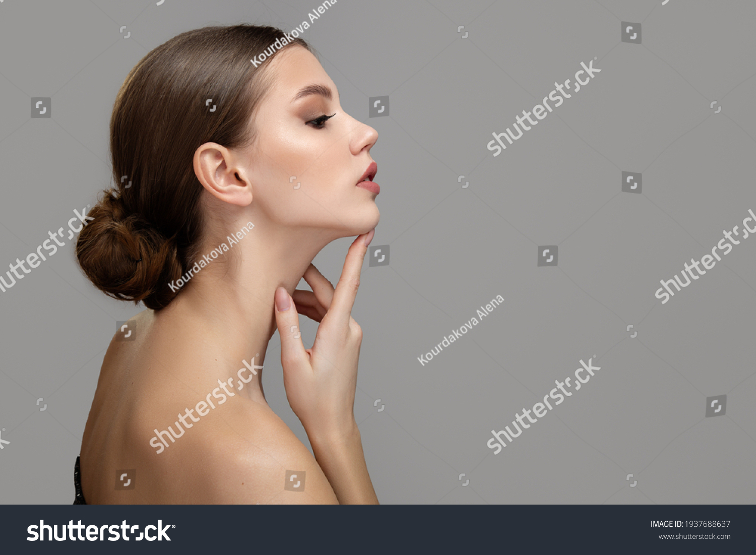 Woman face profile side view. Chin lift pointing with index finger #1937688637
