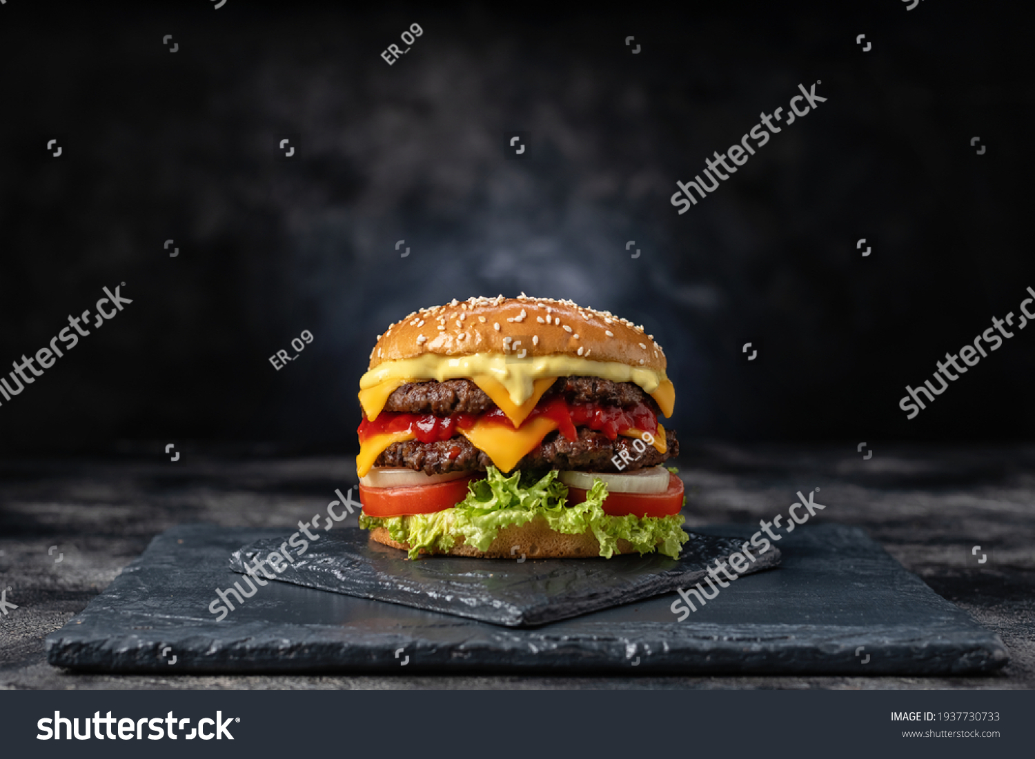 Fresh tasty burger on dark background #1937730733