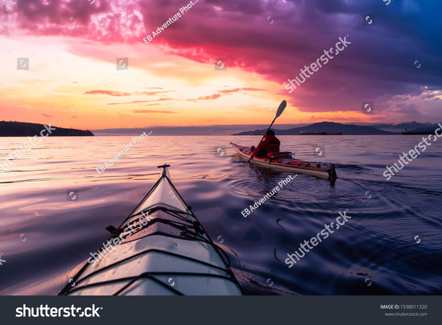 Adventurous Man Sea Kayaking in the Pacific Ocean. Dramatic Colorful Sky Art Render. Taken in Jericho, Vancouver, British Columbia, Canada. #1938011320