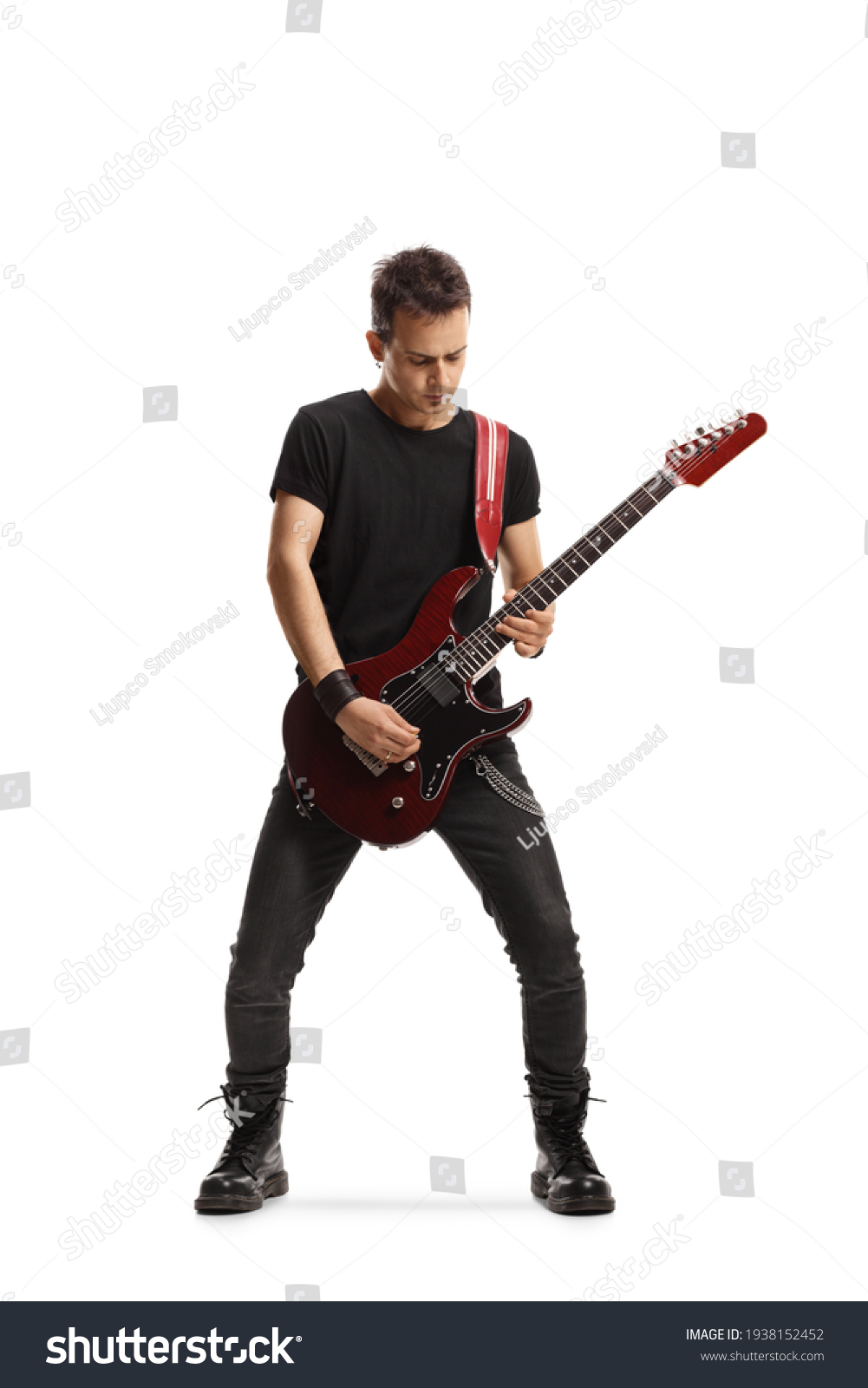 Full length portrait of a guy playing an electric guitar isolated on white background #1938152452