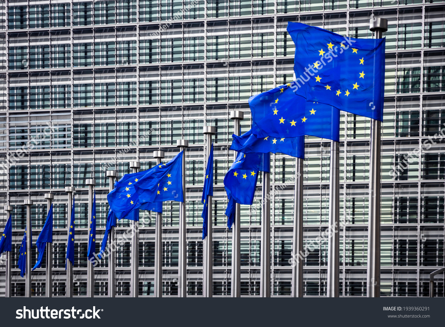 Row of EU Flags in front of the European Union Commission building in Brussels #1939360291