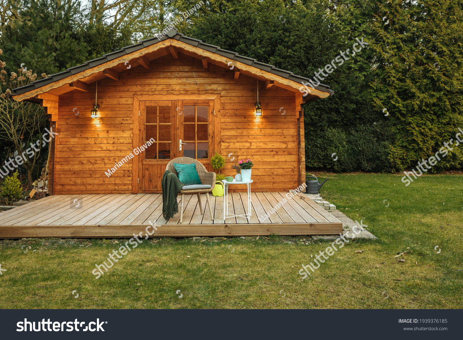 Wooden hut in spring. Drink tea in the garden when the weather is nice. Garden shed for vacation. Nice garden in Germany.  #1939376185