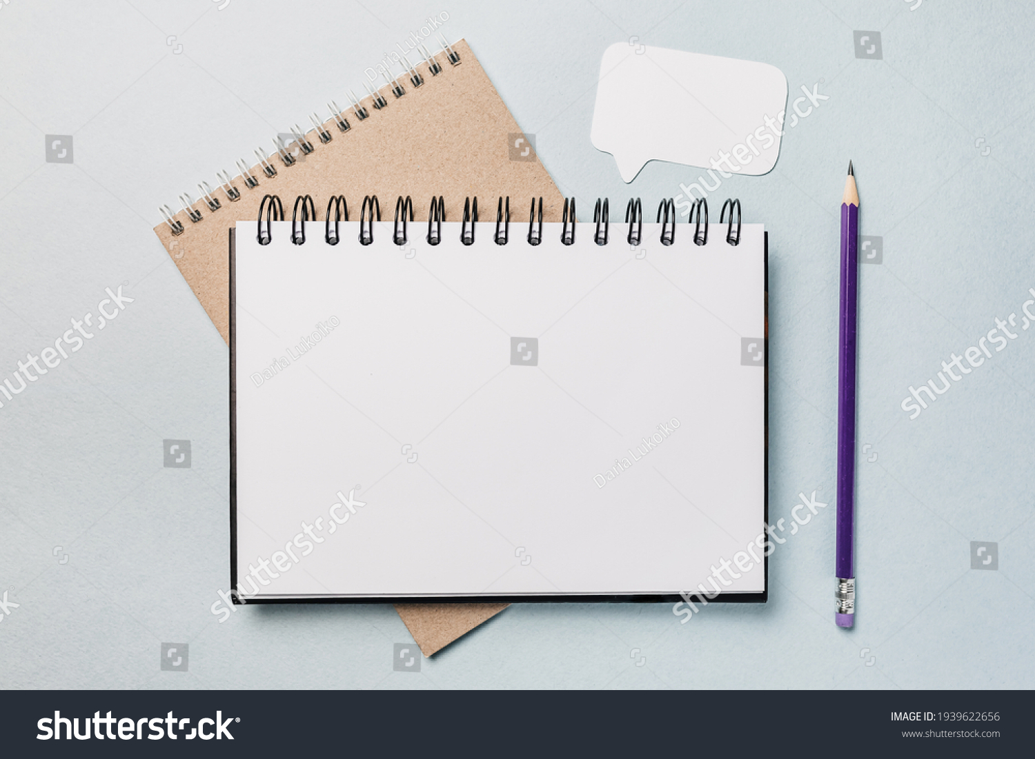 Notepad, white sticker and pensil on the desk. Mock up in copy space office background. It is important not to forget the note #1939622656