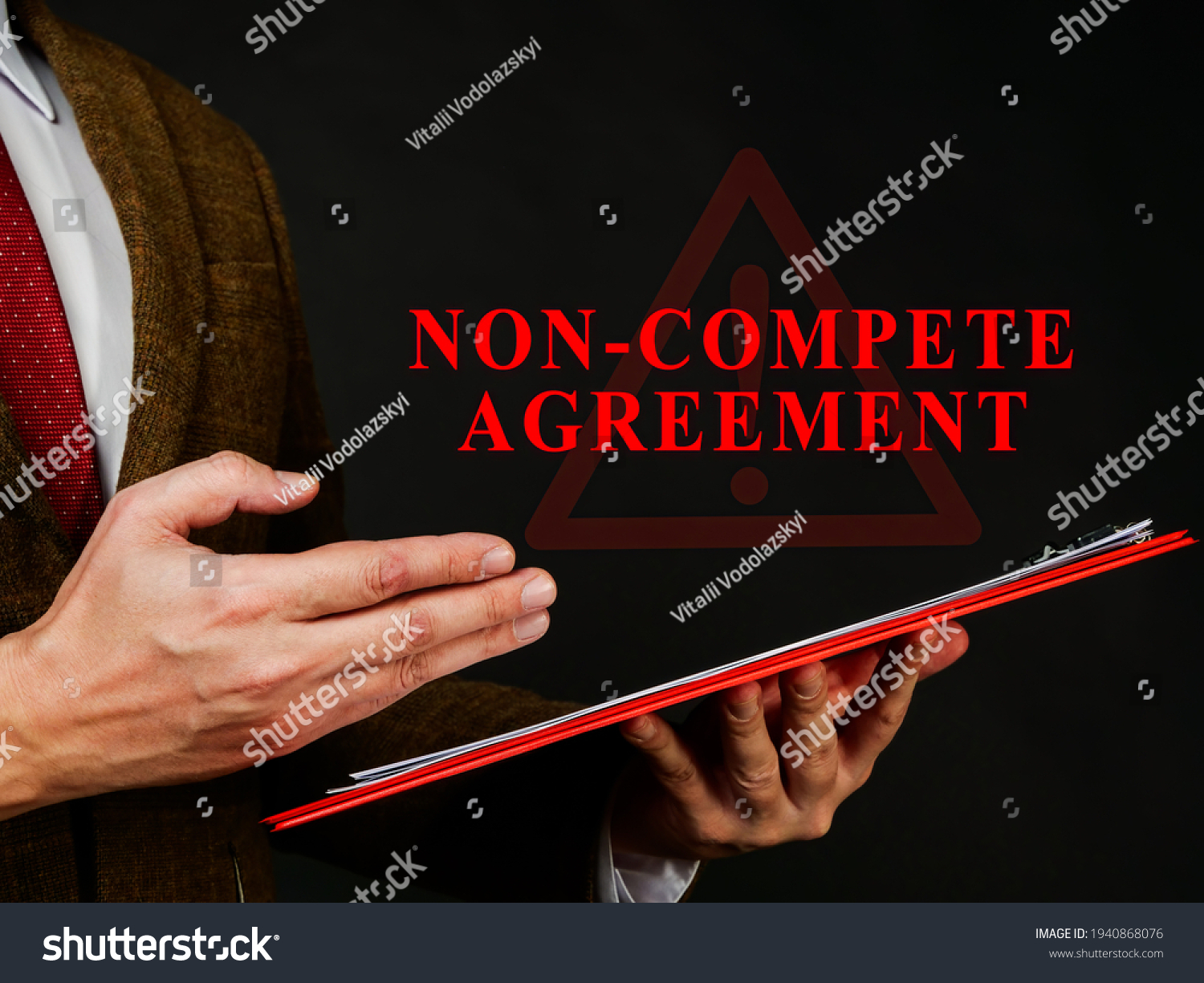Non compete agreement or clause in the red folder. #1940868076