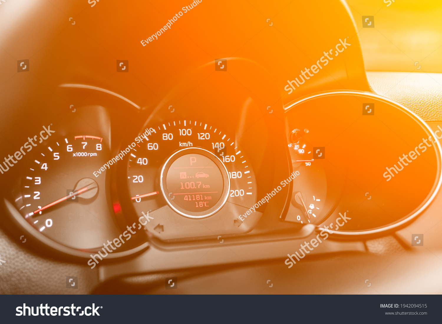 speedometer of a modern car with an integrated fuel gauge in the tank with white arrows under the yellow and orange neon color

 #1942094515