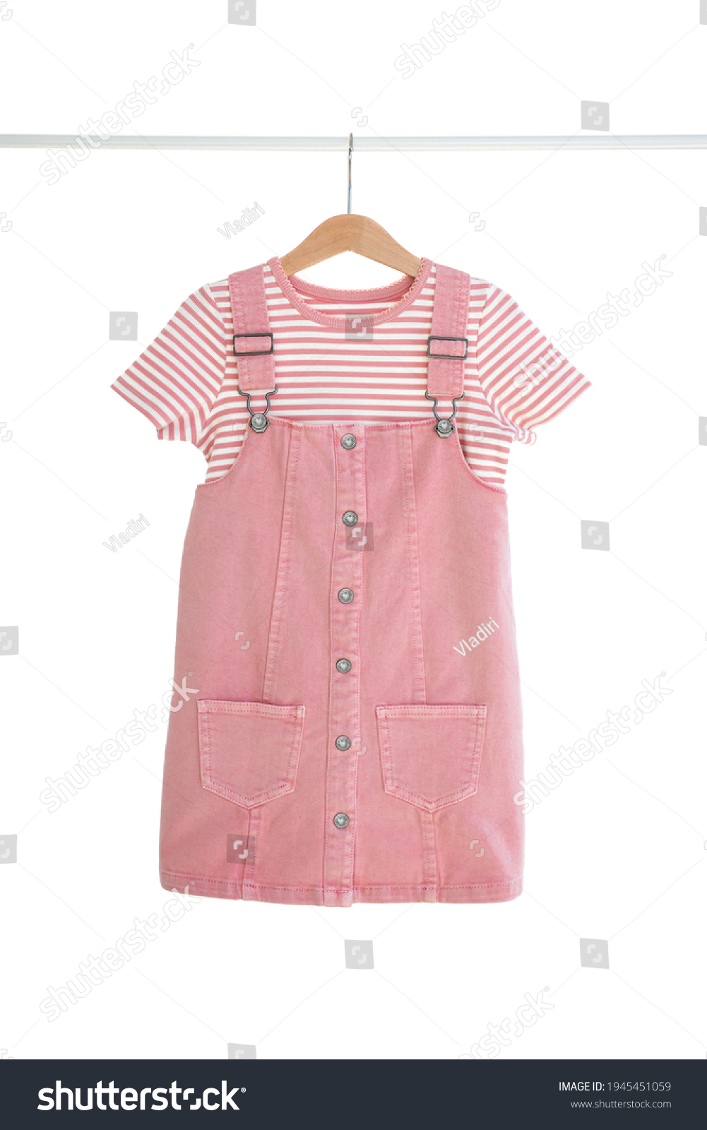 Fashionable women's kids dress and t-shirt hanging on hangers isolated on white background, girl's clothes set #1945451059