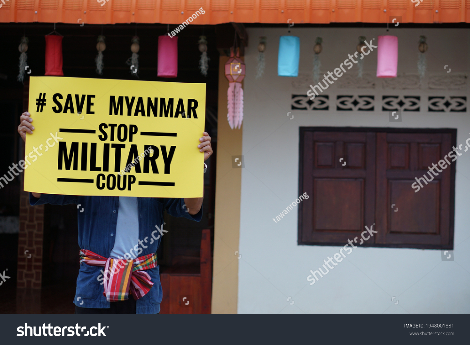 Asian man hold paper sign with text " # Save Myanmar stop nilitary coup". Concepr protest the violence from the coup in Myanmar. #1948001881
