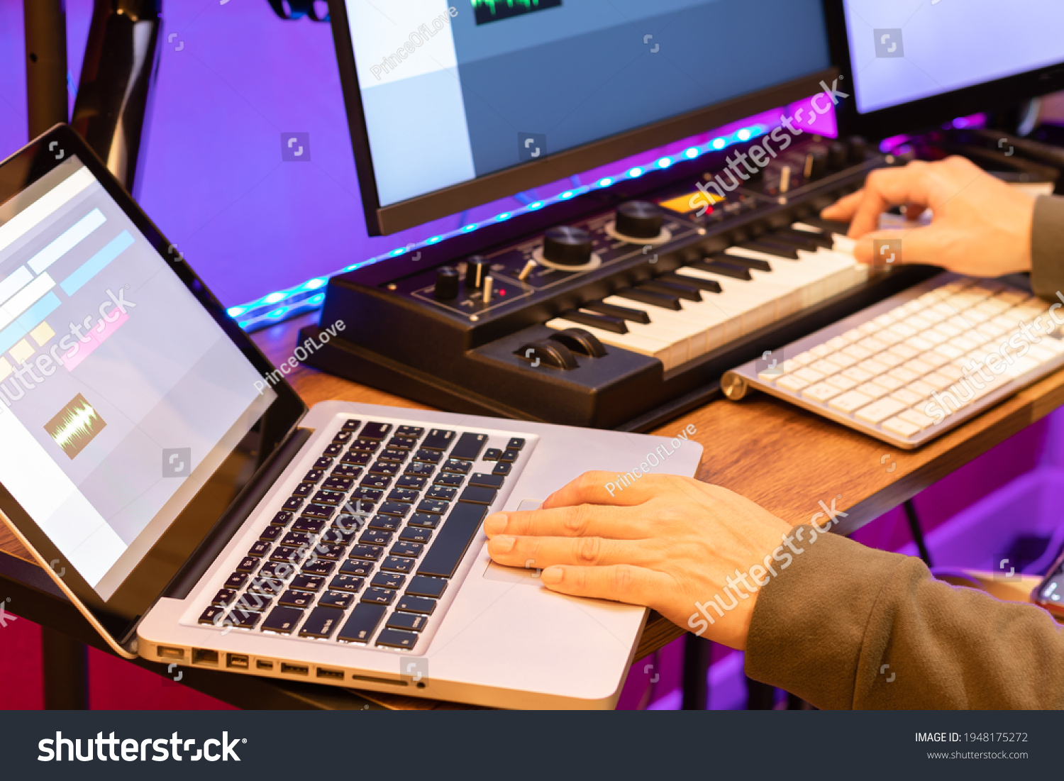 male composer, producer, arranger, song writer, musician hands arranging music on computer in home studio. music production concept #1948175272