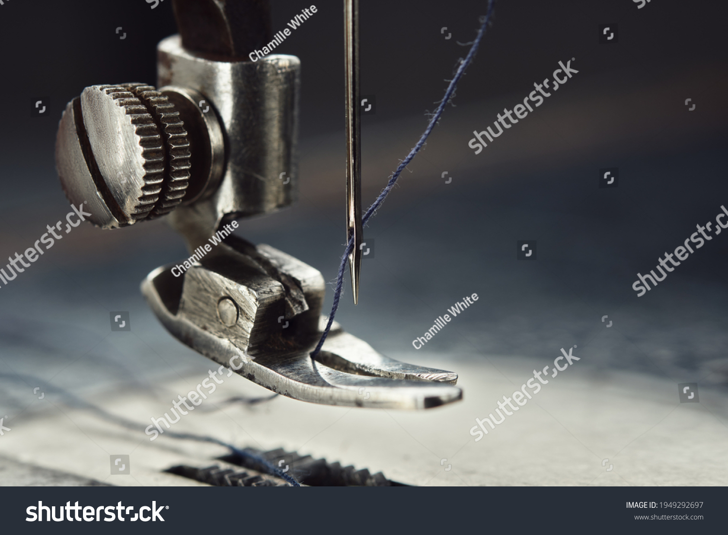 Close up of sewing machine needle with thread. Working part of antique sewing machine. #1949292697