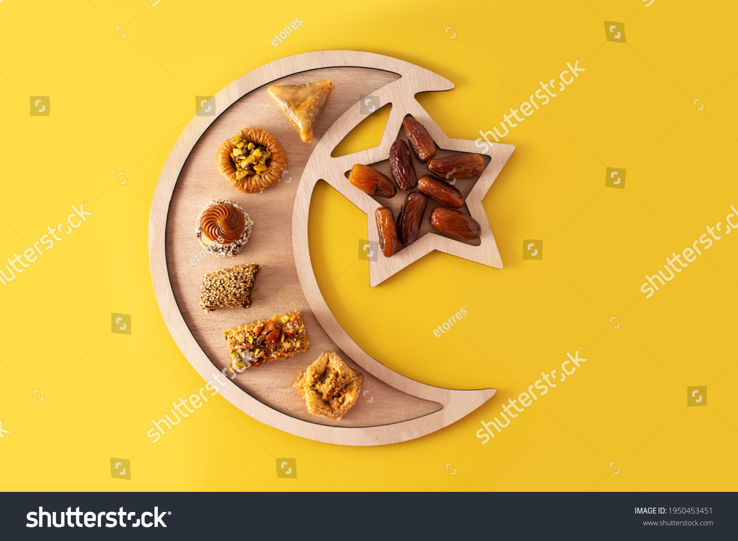 Assortment of Ramadan dessert baklava on yellow background #1950453451