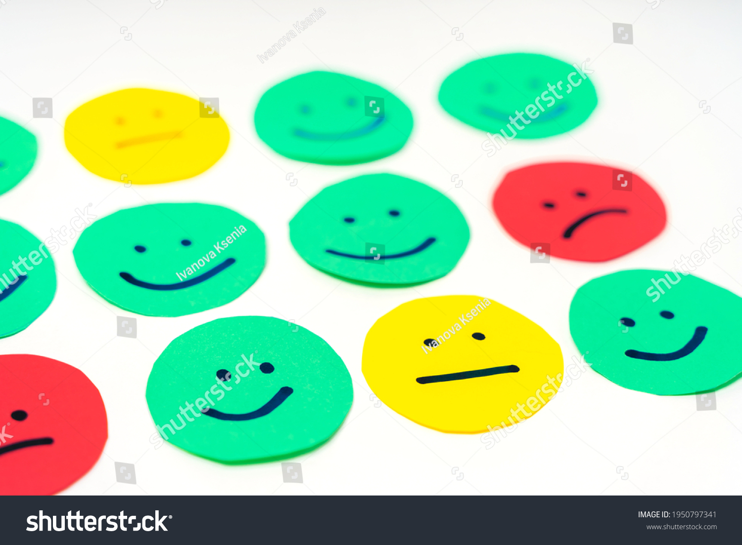 Feedback in the form of faces with emotions of different colors. The concept of a rating scale or sentiment scale #1950797341